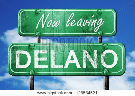 Now leaving delano road sign with blue sky