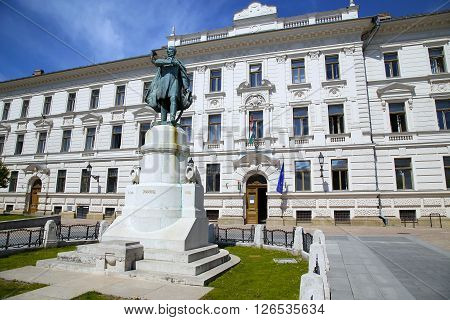 Statue of Lajos Kossuth and governmental building in Pecs Hungary.