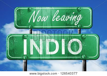 Now leaving indio road sign with blue sky