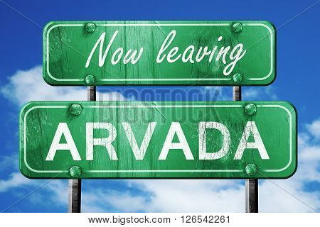Now leaving arvada road sign with blue sky