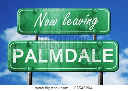 Now leaving palmdale road sign with blue sky