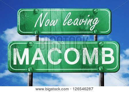 Now leaving macomb road sign with blue sky