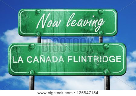 Now leaving la canada flintridge road sign with blue sky