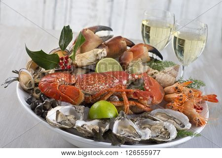 seafood  platter with glass of white wine