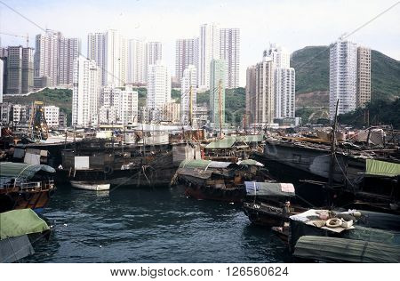 ABERDEEN / HONG KONG - CIRCA 1987: Families live on houseboats in the Aberdeen Floating Village in Hong Kong.