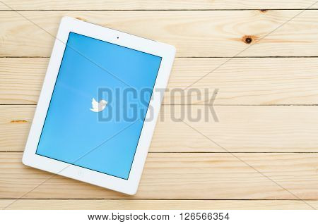 CHIANGMAI THAILAND -DECEMBER 312015:Ipad 4 open Twitter applicationTwitter is an online social networking and microblogging service that enables users to send and read 