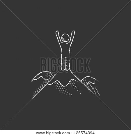 Man standing on top of mountain. Drawn in chalk icon.