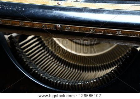 Detail of the metal ruler on the top of mechanical typewriter