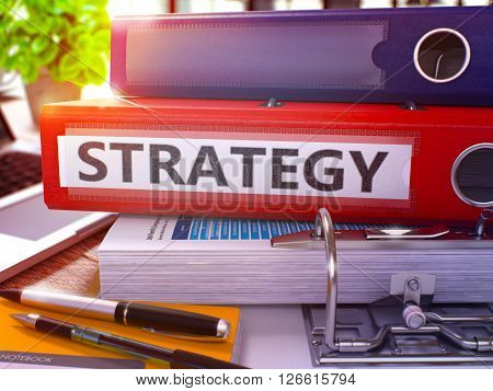 Strategy - Red Ring Binder on Office Desktop with Office Supplies and Modern Laptop. Strategy Business Concept on Blurred Background. Strategy - Toned Illustration. 3D Render.