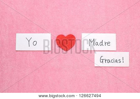 I Love Mom concept in Spanish. 
Red heart and hand written letters spelling I Love mom concept in Spanish.