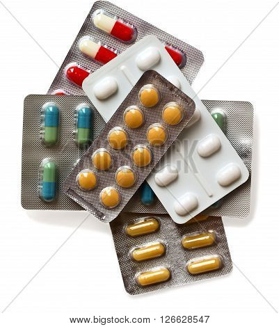 different multicolored pills isolated on white background