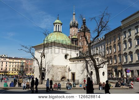 Cracow Poland - April 2 2016: St. Adalbert (in The Foreground) And St. Mary Churches In The Main Squ