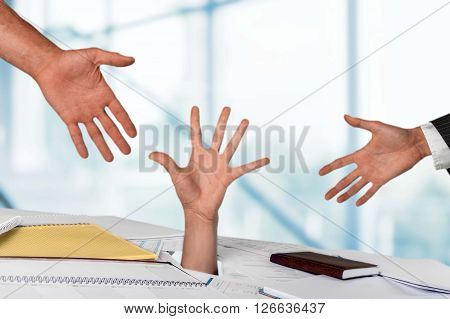 Close up of businesswoman hand in stack of papers