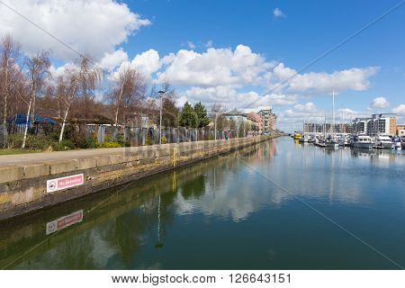Portishead near Bristol Somerset England UK with blue sky on a spring day and boats moored at quayside and apartments