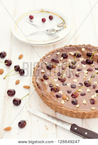 Tart cake with chocolate and cherries.Selective focus on the tart cake