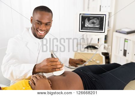 Gynecologist Checking Pregnant Woman's Belly With Ultrasound Transducer In Hospital
** Note: Shallow depth of field