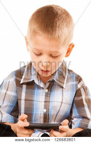 Leisure technology and internet concept - little boy with smartphone playing games or reading text message