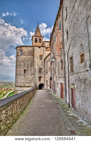 picturesque old alley with underpass under the Saint Augustine church in the medieval village Anghiari, Arezzo, Tuscany, Italy