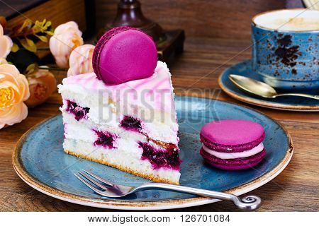 Sweet and Colourful Cake with French Macaroons with Cup of Cofee. Studio Photo