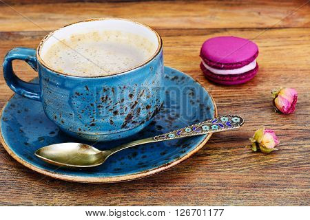 Sweet  French Macaroons with Cofee Cup. Studio Photo