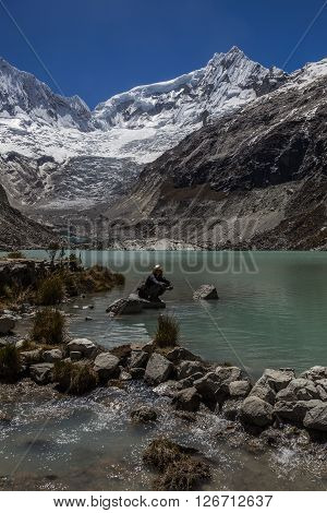 Llaca lagoon (4474 m) in the peruvian Andes and Ocshapalpa peak (5888 m) and Ranrapalca peak (6162 m) Peru