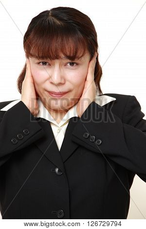Asian businesswoman suffers from noise on white background