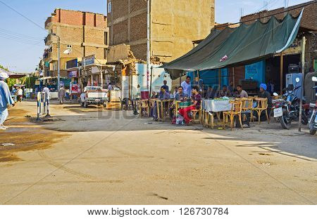 EDFU EGYPT - OCTOBER 7 2014: The outdoor teahouse in a central residential district faces on the road on October 7 in Edfu.