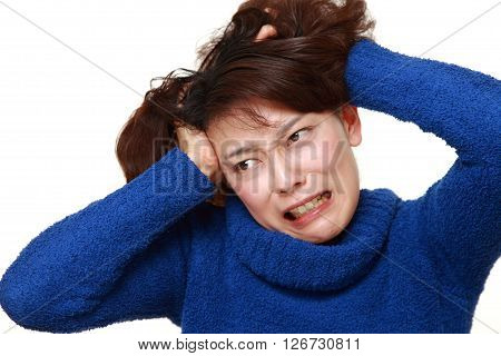 portrait of demented woman on white background