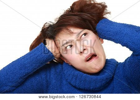 portrait of demented woman on white background