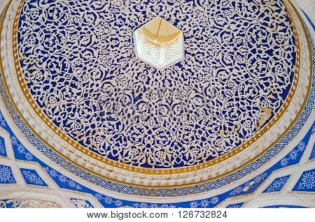 KOKAND UZBEKISTAN - MAY 6 2015: The blue cupola of the entrance gate of of Khudayar Khan Palace covered by fine white patterns on May 6 in Kokand.