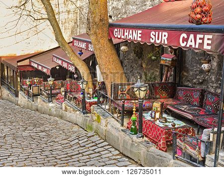 ISTANBUL TURKEY - JANUARY 21 2015: The traditional Turkish cafe with the cozy alcoves and decorated trestle-beds located on Sogukcesme street on he half-way to the Topkapi Palace on January 21 in Istanbul.