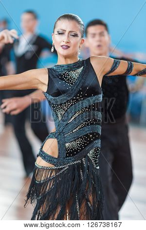 Minsk Belarus -April 3 2016: Silich Sergey and Borovskaya Olga Perform Youth Latin-American Program on IDSA Championship Kinezis Star Cup - 2016 in April 3 2016 in Minsk Republic of Belarus