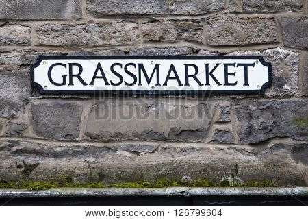 A street sign for Grassmarket in the historic city of Edinburgh Scotland.