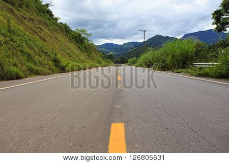 empty brazilian road at sunny cloudy day
