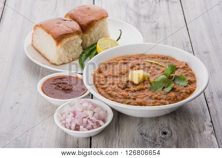 Pav Bhaji or paav bhaji, Indian spicy fast food with bread, onion and butter, Indian food, Mumbai food