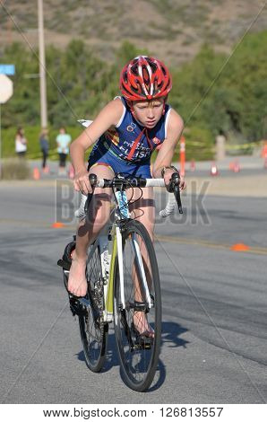 Hemet California/USA-April 17 2016:kid on bike in the Diamond Valley Triathlon