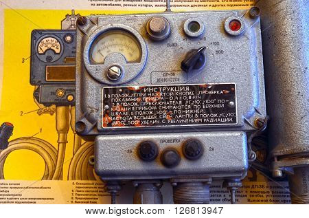 ILLUSTRATIVE EDITORIAL.Vintage Soviet military radiometer DP-3B.For tanks and another transport.Background - poster Soviet Civil Defense: DP-3B,design and usage.At April 19,2016 Kiev, Ukraine
