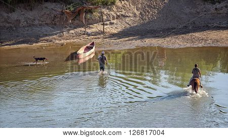 BIG BEND NATIONAL PARK, TEXAS - APRIL 3: Illegal Mexican nationals cross the Rio Grande River back into Mexico at Big Bend National Park after selling souvenirs to american tourists on April 4th, 2016.