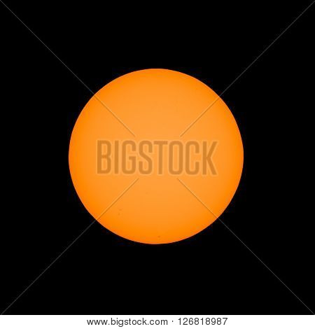 The Sun seen with telescope with solar filter from planet Earth with sunspots visible as dark spots compared to surrounding regions (Real photo with my own telescope no NASA images used)