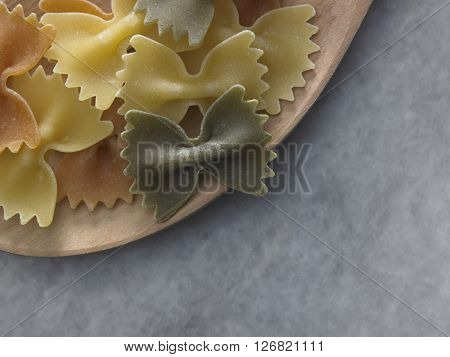 dry farfalloni pasta on the marble top