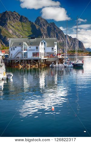 Henningsvaer, Norway - July 21, 2011 - View To Typical Norwegian Village With Wooden Houses In Henni