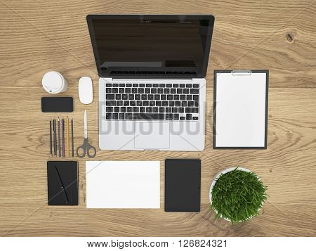 Topview of textured wooden table with blank laptop plant and office tools organized neatly. Mock up 3D Rendering