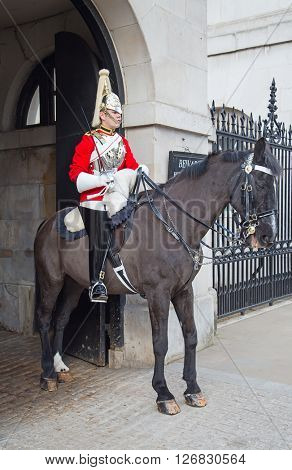 WINDSOR - APRIL 17: Unidentified man on the horse, guard protecting entrance to the Whitehall palace on April 17, 2016 in London, United Kingdom.