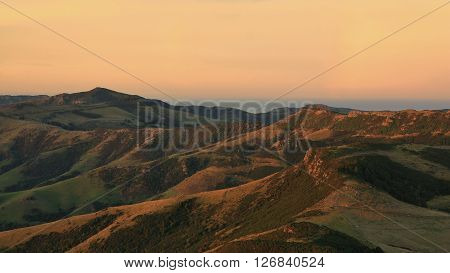 Evening scene on the Banks Peninsula. Hills near Akaroa, New Zealand.