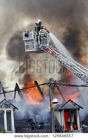 Fire fighter fighting a burning house with water
** Note: Visible grain at 100%, best at smaller sizes