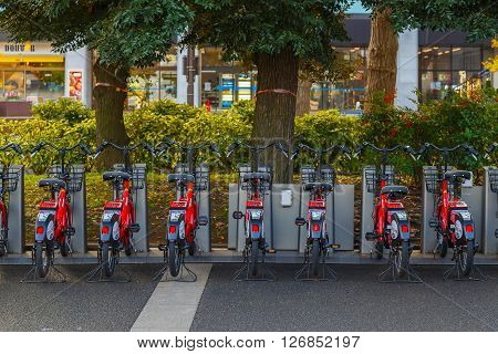 YOKOHAMA JAPAN - NOVEMBER 24 2015: Bay Bike is a bicycle sharing system that has docking ports in designated areas managed by Docomo Japan's biggest private telecommunicatiom company