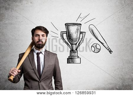 Businessman with bat and cup trophy skecth on concrete wall