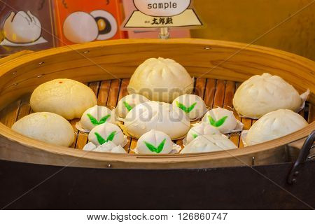 Chinese steamed buns in a steamed basket