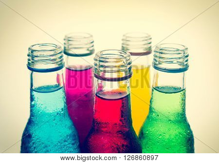 close up the cool colorful drink in the glass bottle