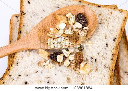 closeup the cereal and black sesame bread with whole grain cereal flakes which mixed warming cinnamon red skin apple golden raisins and roasted hazelnuts